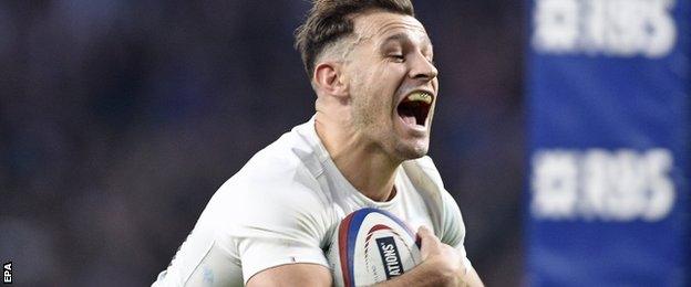 Scrum-half Danny Care dives over to score England's final try