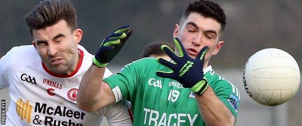 Tiernan McCann of Tyrone in action against Fermanagh's Eddie Courtney at Clones