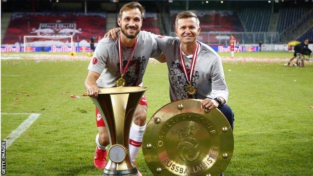 Jesse Marsch (right) celebrates winning the league and cup double in his first season at RB Salzburg