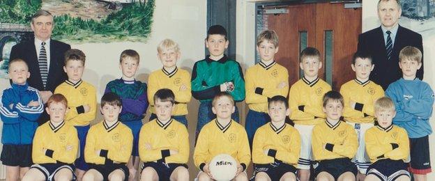 Steven Davis (holding ball) was captain of the Bruce Memorial football team in 1996