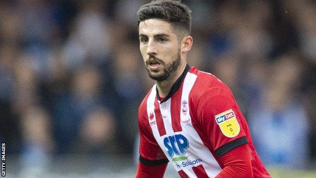 Tom Pett in action for Lincoln City