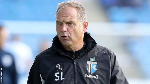 Gillingham boss Steve Lovell looks on from the sidelines