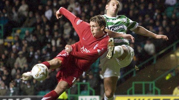 Lee Miller is closed down by John Kennedy during an Aberdeen and Celtic game