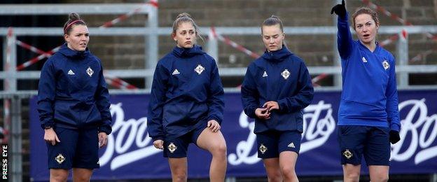 Kelsie Burrows, Abi Magee and Emily Wilson watch Marissa Callaghan