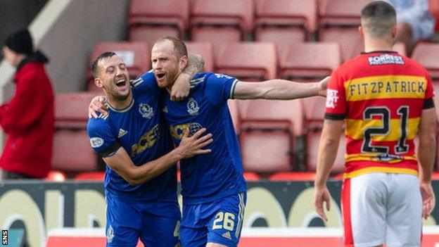 Mark Reynolds (centre right) scored twice late on for Cove Rangers