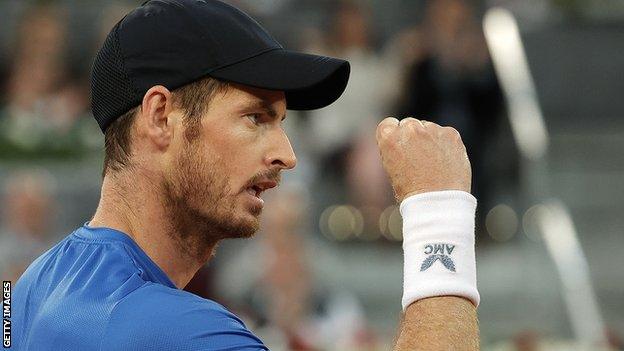 Andy Murray celebrates beating Denis Shapovalov in the Madrid Open second round