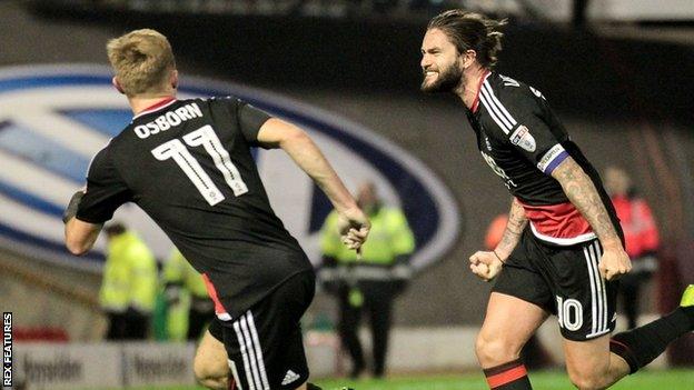 Henri Lansbury celebrates