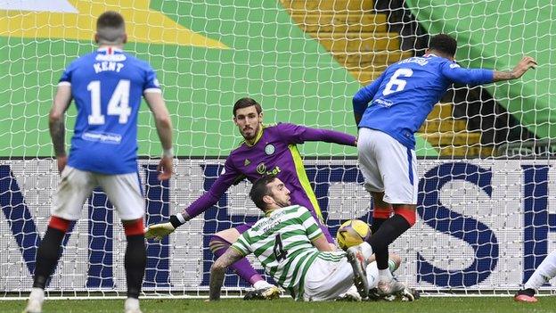 Connor Goldson shoot towards the Celtic goal