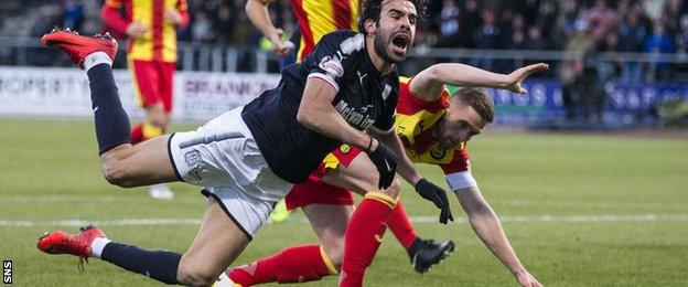 Sofien Moussa is brought down by Partick Thistle's Danny Devine