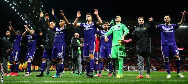 Anderlecht salute their fans at Old Trafford after losing their Europa League quarter-final tie against Manchester United 3-2 on aggregate