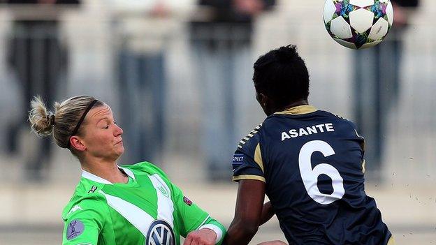 Anita Asante of Rosengard and Alexandra Popp of Wolfsburg compete during the first UEFA Women's Champions League quarter final match between VfL Wolfsburg and FC Rosengard at the AOK Stadion on March 22, 2015