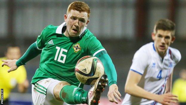 Shayne Lavery (left) in action for the Northern Ireland Under-21s against Iceland last March