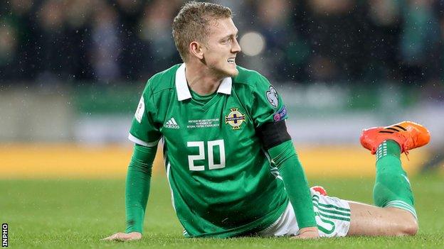 George Saville shows his frustration during Northern Ireland's World Cup play-offs defeat by Switzerland last November