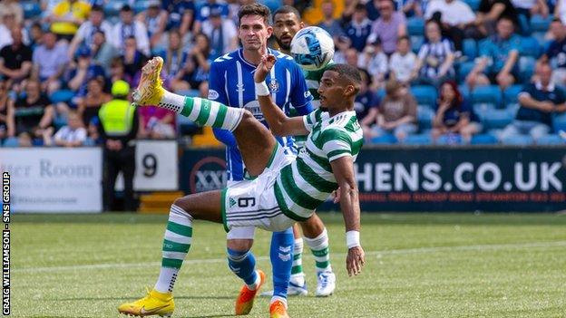 Moritz Jenz fires in an acrobatic effort for Celtic's third