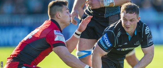 Damien Hoyland of Edinburgh tackles Glasgow Warriors' Nick Grigg