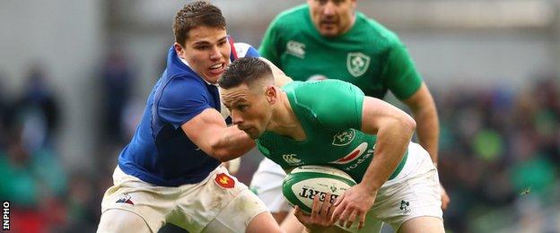 Antoine Dupont and John Cooney in action during France's Six Nations game against Ireland in 2019