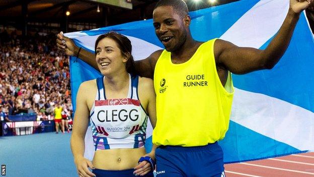 Libby Clegg and guide runner Mikail Huggins celebrate winning the Women's Para-Sport 100m T12 at Glasgow 2014