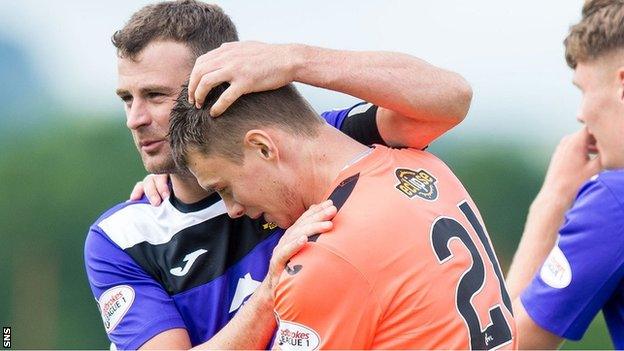 East Fife goalkeeper Willie Muir receives congratulations