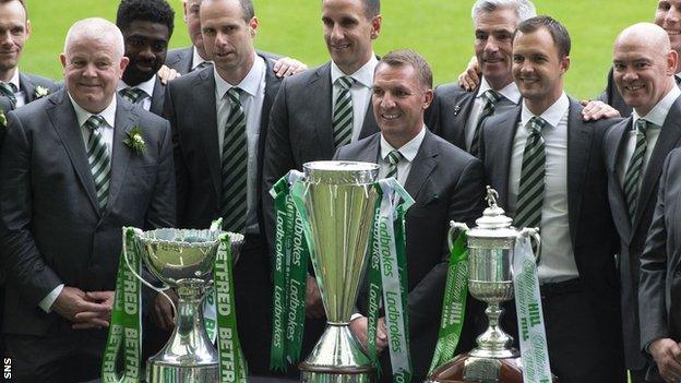 Celtic staff with the Scottish domestic trophies