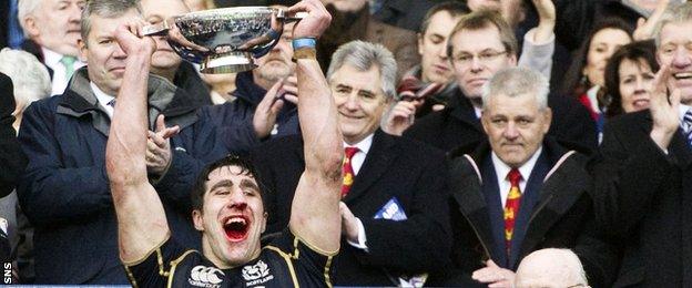 Scotland captain Kelly Brown celebrates victory over Ireland in 2013 as the-then Lions head coach Warren Gatland looks on