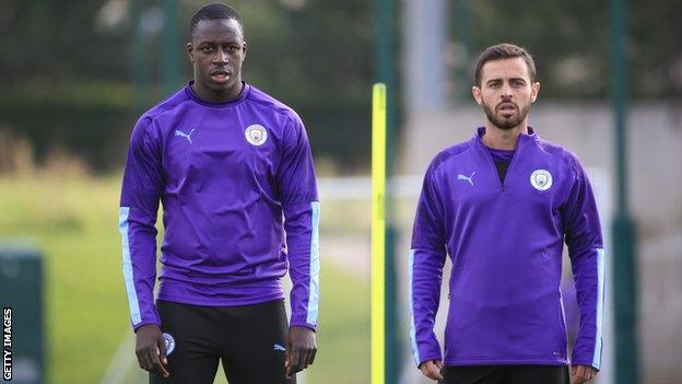 Manchester City players Benjamin Mendy (left) and Bernardo Silva (right) in training