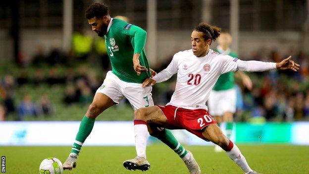 Cyrus Christie attempts to get past Denmark's Yussuf Poulson in Dublin