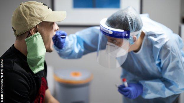 Zak Chelli takes a Covid-19 test