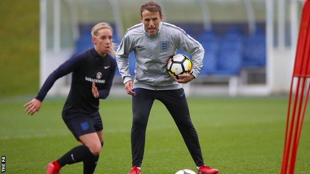 Phil Neville watches midfielder Jordan Nobbs train