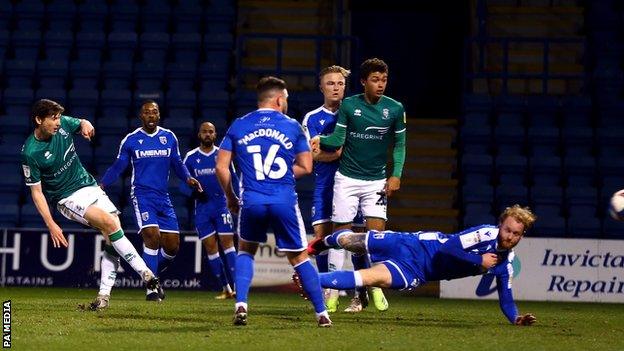 Conor McGrandles opens the scoring for Lincoln at Gillingham