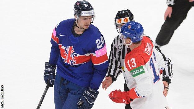 Great Britain and Czech Republic ice hockey players confront each other