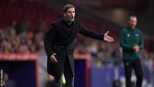 Robert Moreno points on the touchline during a match in charge of Spain