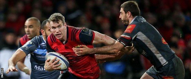 Munster centre Chris Farrell is tackled by Yannick Caballero in the victory over Castres on Sunday