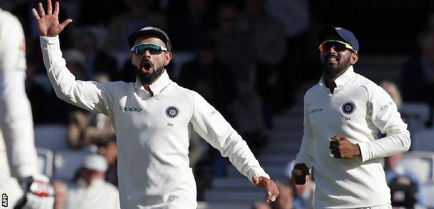 Virat Kohli celebrates a wicket