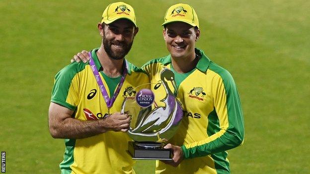 Australia's Glenn Maxwell and Alex Carey with the ODI series trophy