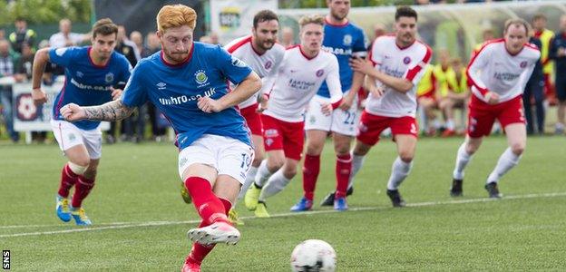 Louis Rooney scores a penalty for Linfield against Spartans