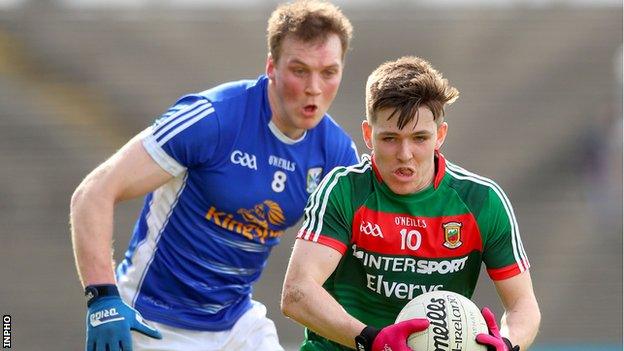 Cavan’s Gearoid McKiernan tries to catch Fergal Boland of Mayo