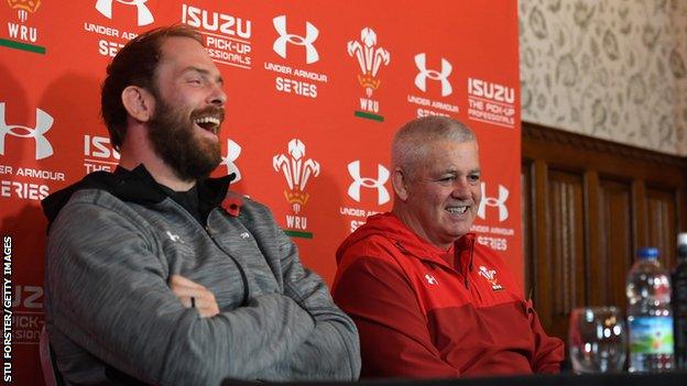 Warren Gatland shares a joke with captain Alun Wyn Jones as they face the media