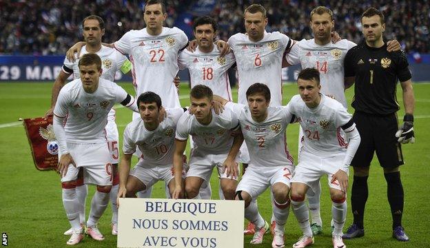 Russian players pay their respects to the victims of last week's Brussels attacks