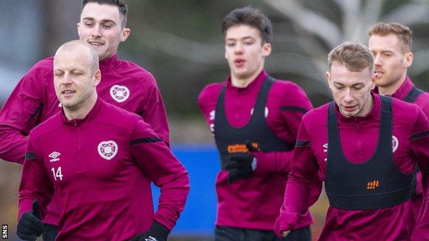 Steven Naismith leads the Hearts players at training