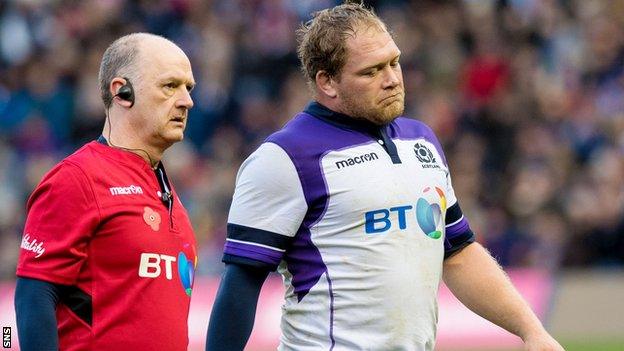 WP Nel departs the action against Samoa, accompanied by Scotland team doctor James Robson