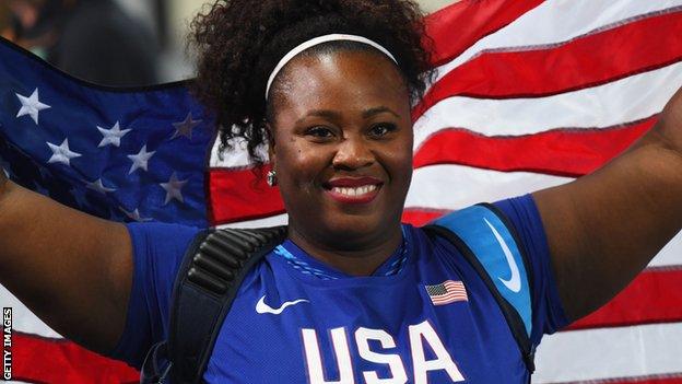 Michelle Carter in red lipstick and make-up during the shot put