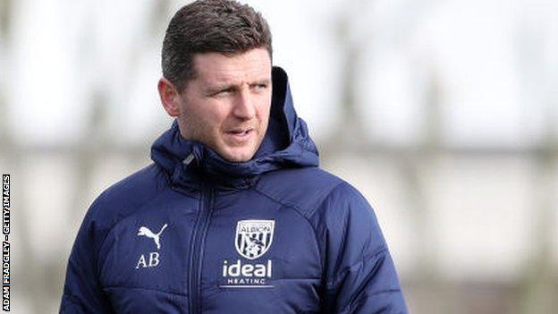 Alex Bruce, who helped his dad to two of his four Championship promotions with Hull City, has taken on his first coaching role at The Hawthorns