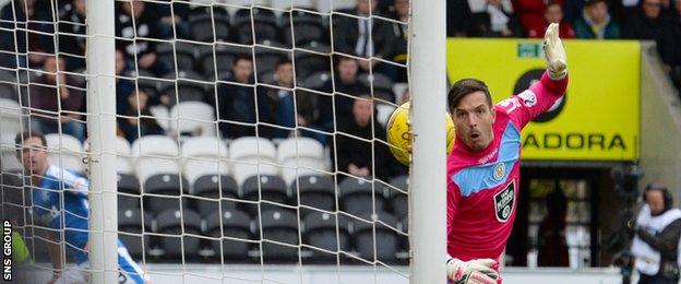 St Mirren goalkeeper Jamie Langfield watches as Jason Holt's shot hits the target