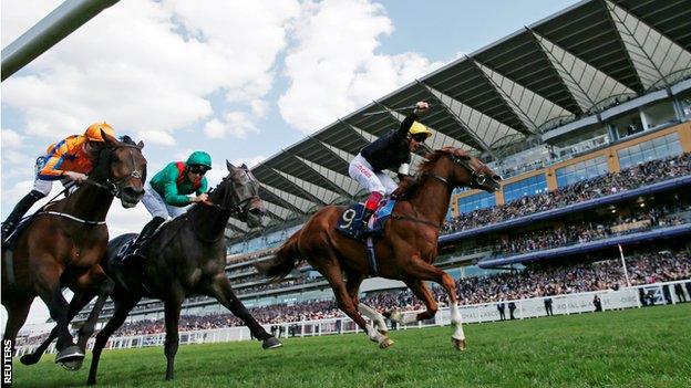 Frankie Dettori celebrates as Stradivarius takes victory ahead of Vazirabad and Torcedor