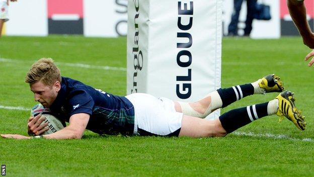 Finn Russell scores a try for Scotland against Japan