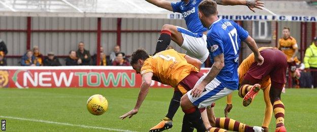 Ben Heneghan dives forward to head home Motherwell's equaliser