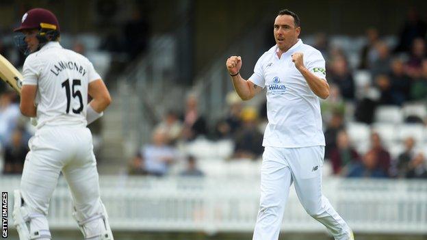 Hampshire seamer Kyle Abbott celebrates dismissing Tom Lammonby