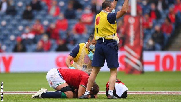 Alun Wyn Jones on the ground with his head in his hands