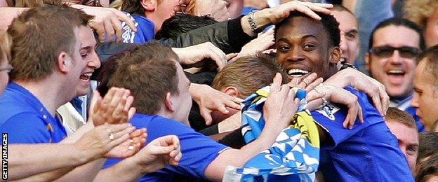 Michael Essien is mobbed by Chelsea fans