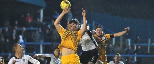 Morton midfielder Ross Forbes handles the ball in his own box and concedes a penalty